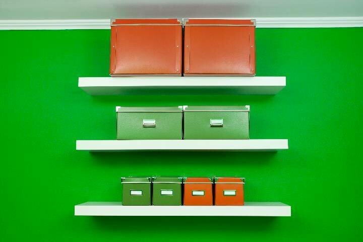 Storage boxes on shelves on wall