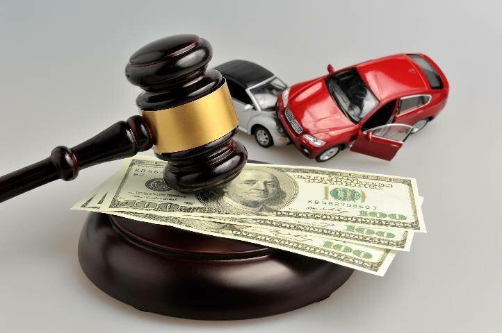 Gavel with cash and toy cars
