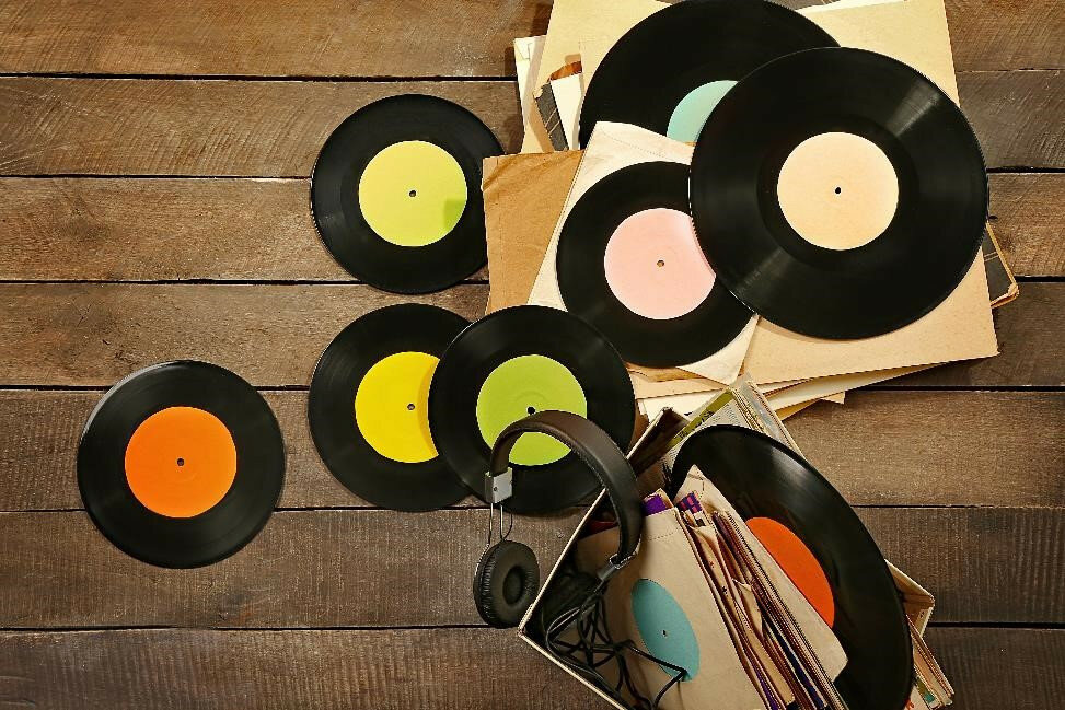 blank records sprawled across a wooden table
