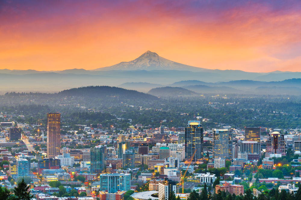 aerial image of portland with mount hood in the back during a sunset