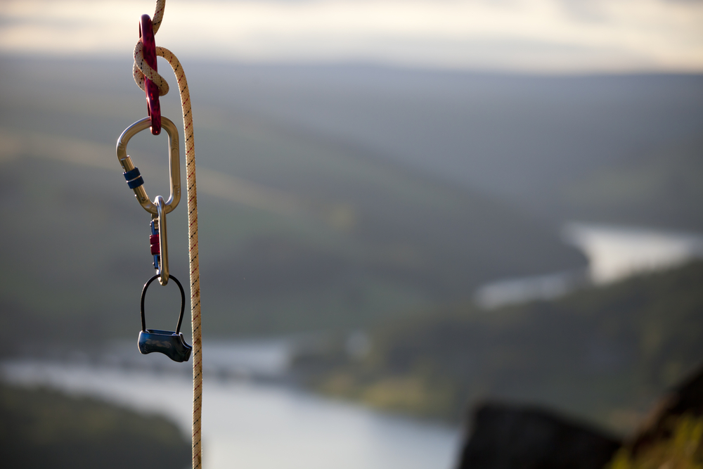 climbing gear in focus with view of river in background