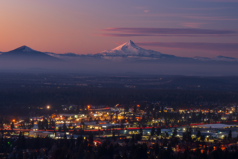 View of Bend, Oregon during a sunset with a mountain in the background