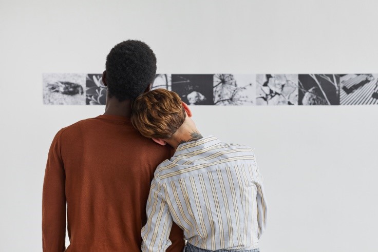 interracial couple looking at artwork