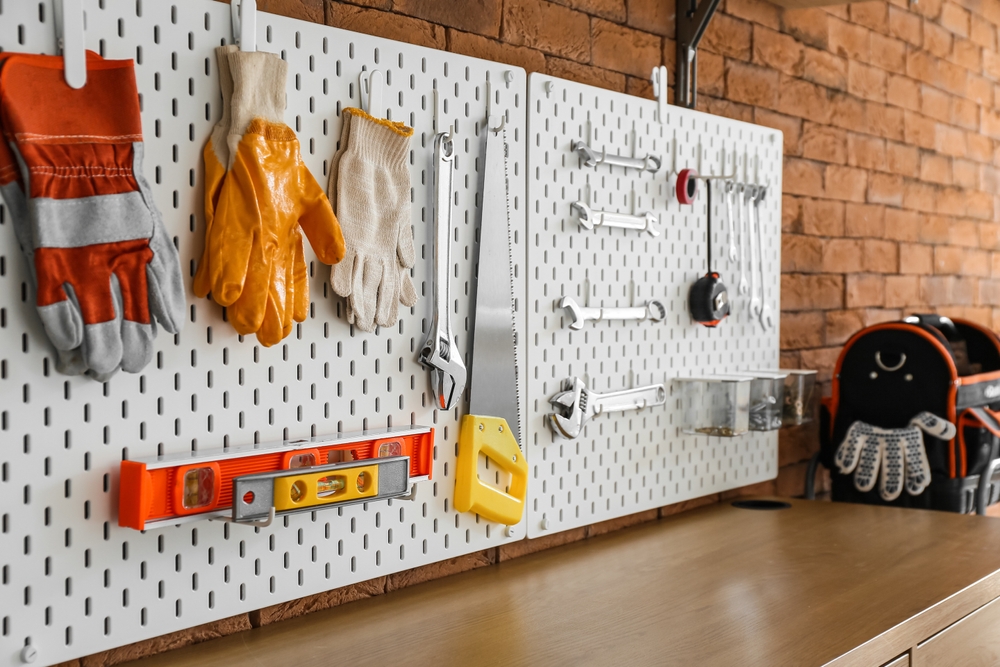 Pegboards with various tools hung up on it