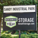 Front sign view of Northwest Self Storage facility in Sandy, OR on Industrial Way